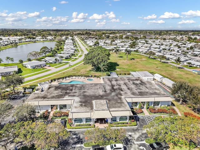 drone / aerial view with a residential view and a water view