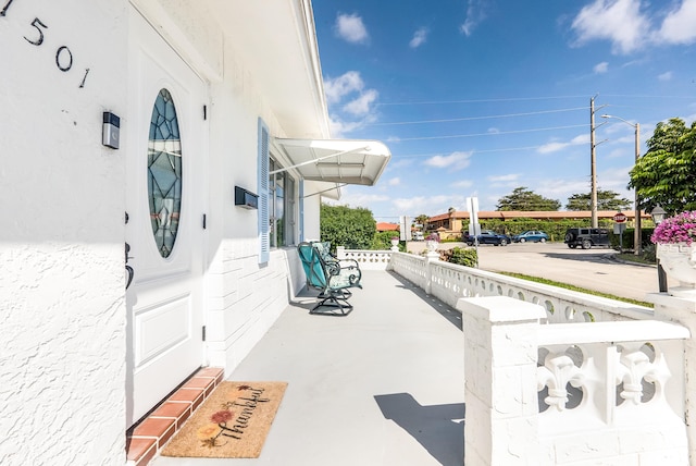 view of patio featuring a porch