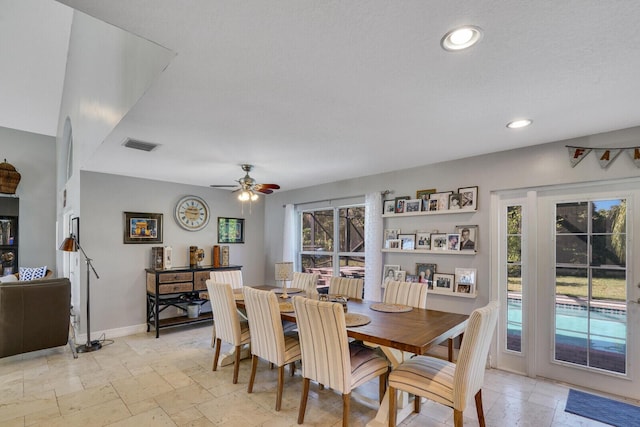 dining room featuring ceiling fan, recessed lighting, stone tile floors, visible vents, and baseboards