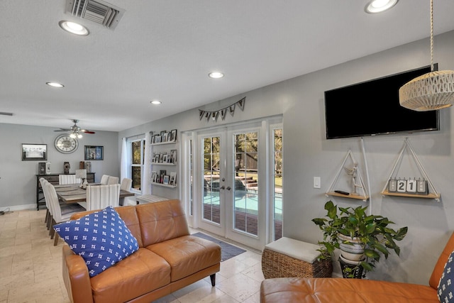 living area featuring recessed lighting, french doors, and visible vents