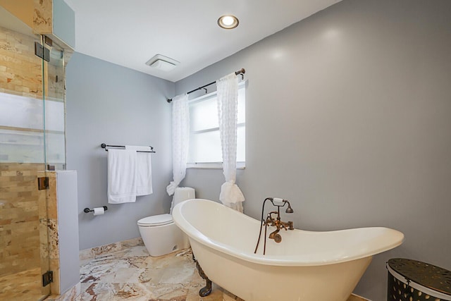 full bath featuring recessed lighting, marble finish floor, a freestanding bath, and a shower stall