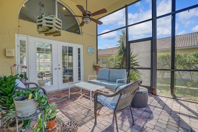 sunroom with ceiling fan and french doors