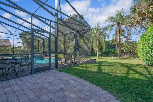 view of yard featuring an outdoor pool, glass enclosure, and a patio