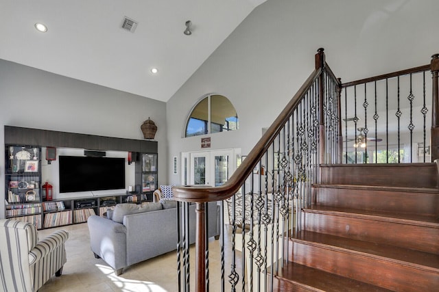 stairs with high vaulted ceiling, visible vents, french doors, and recessed lighting