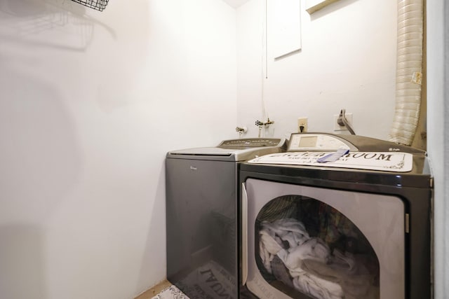 washroom with washer and dryer and laundry area