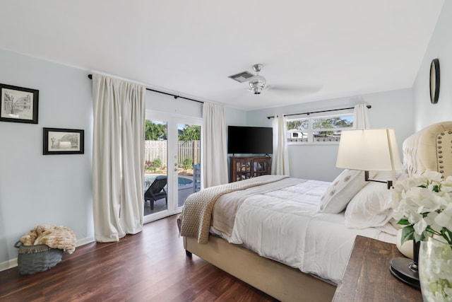 bedroom featuring access to outside, dark wood-type flooring, multiple windows, and visible vents