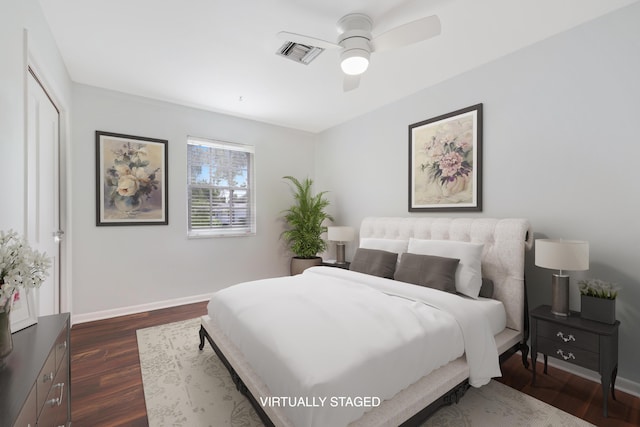 bedroom with ceiling fan, dark wood-type flooring, visible vents, and baseboards