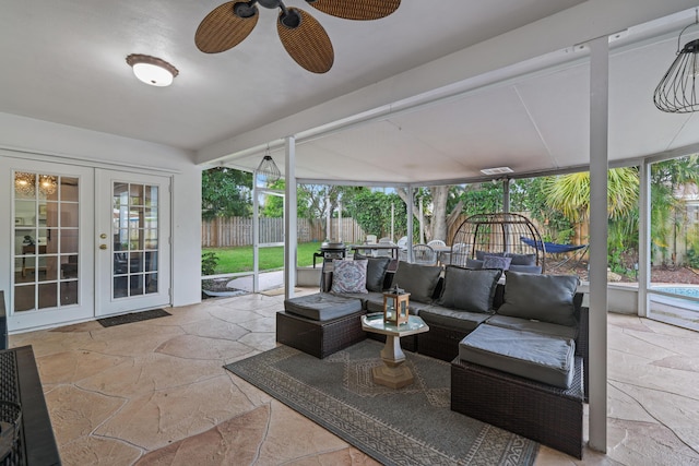 sunroom with ceiling fan and french doors