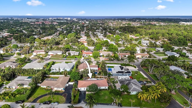 birds eye view of property with a residential view