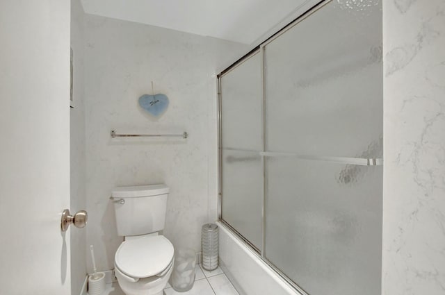 bathroom with enclosed tub / shower combo and toilet