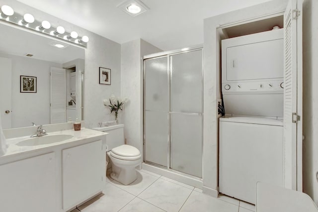 bathroom with stacked washer and dryer, a closet, a shower stall, and toilet