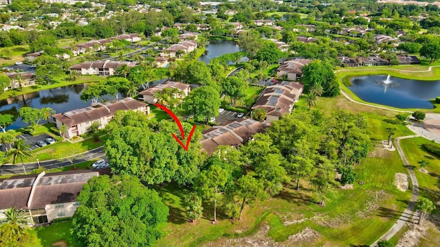 bird's eye view with a water view and a residential view