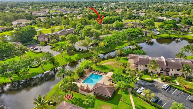 bird's eye view featuring a residential view and a water view