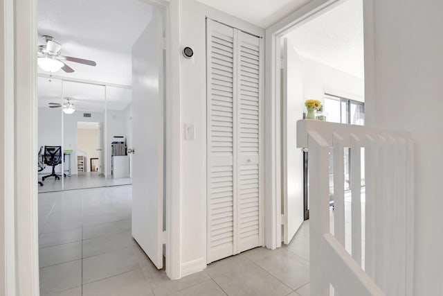 hall with light tile patterned flooring