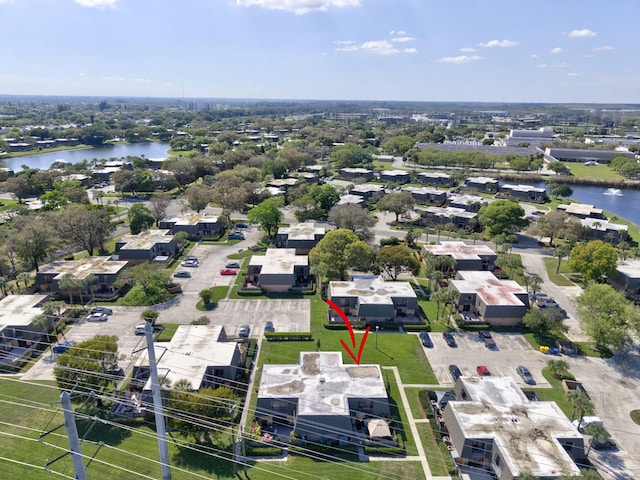 aerial view featuring a water view and a residential view