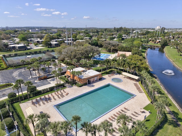 birds eye view of property with a water view