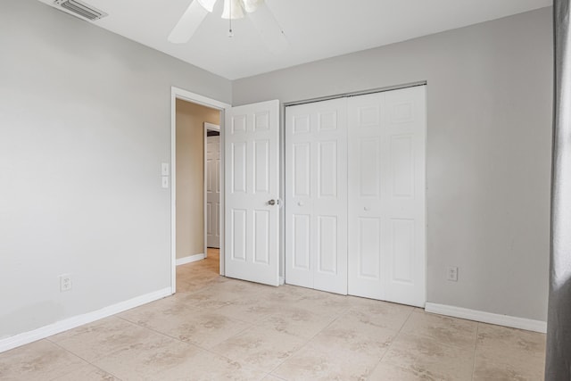 unfurnished bedroom featuring a ceiling fan, baseboards, visible vents, and a closet