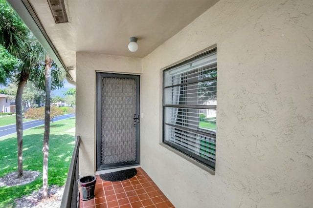 property entrance with stucco siding