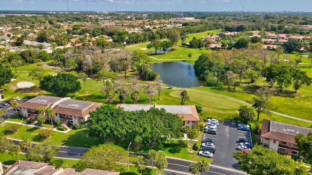 birds eye view of property featuring a water view, a residential view, and golf course view