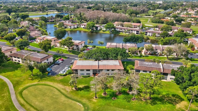 birds eye view of property featuring a water view and a residential view