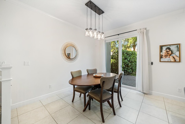 dining room featuring light tile patterned floors, baseboards, a notable chandelier, and crown molding