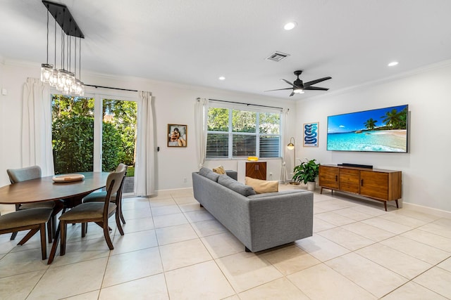 living room featuring light tile patterned floors, plenty of natural light, visible vents, and ornamental molding