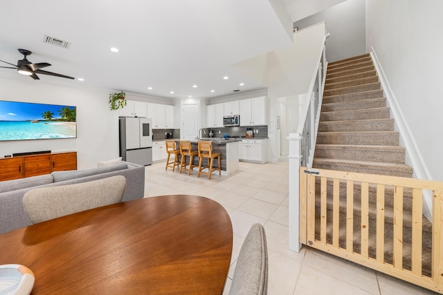 dining area with recessed lighting, stairs, visible vents, and light tile patterned flooring