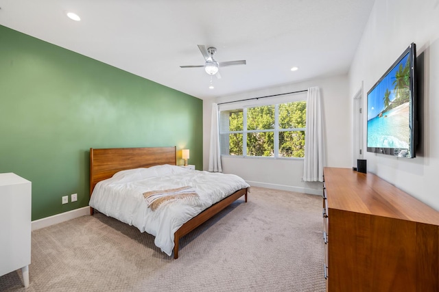 bedroom featuring recessed lighting, light carpet, and baseboards