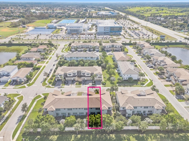 aerial view featuring a residential view and a water view