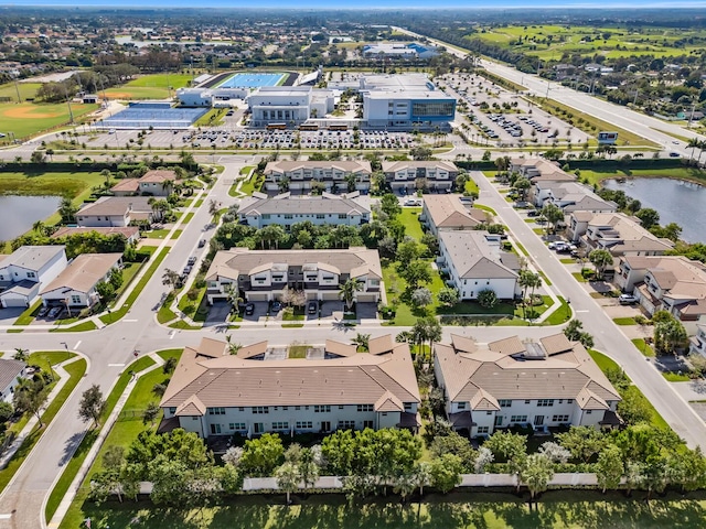 birds eye view of property featuring a water view and a residential view