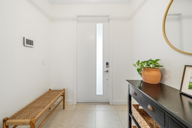 entryway with baseboards and light tile patterned floors