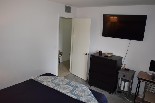 bedroom with carpet floors and visible vents