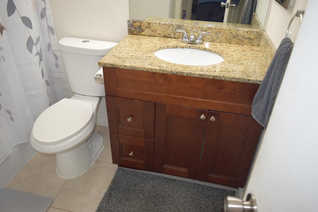 full bathroom with curtained shower, vanity, toilet, and tile patterned floors