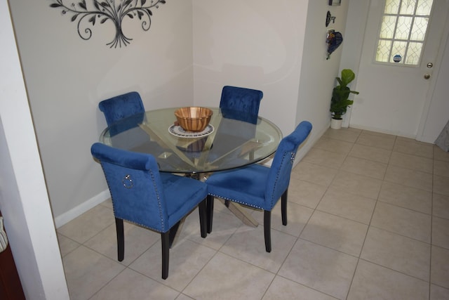 tiled dining area with baseboards