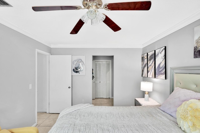 bedroom featuring light tile patterned floors, visible vents, a ceiling fan, and crown molding