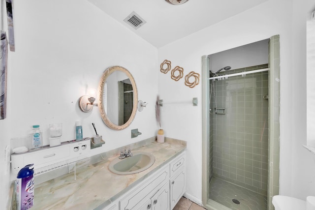 full bathroom with vanity, visible vents, tile patterned flooring, and a stall shower