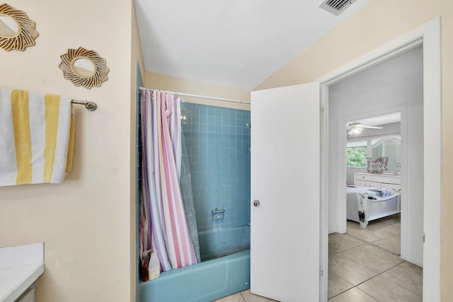 bathroom featuring vanity, a ceiling fan, visible vents, tile patterned flooring, and shower / tub combo