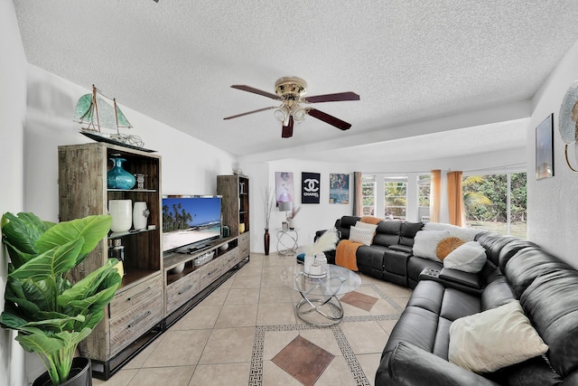 living room with light tile patterned floors, a textured ceiling, lofted ceiling, and ceiling fan
