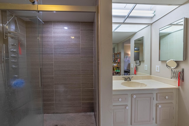 bathroom featuring a stall shower and vanity