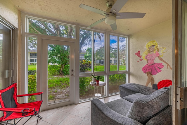 sunroom featuring ceiling fan