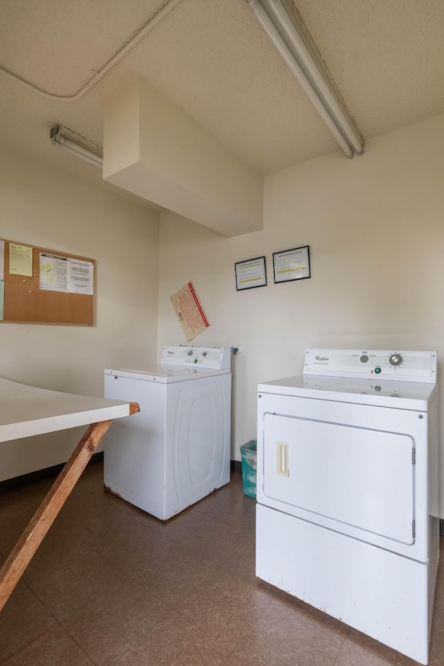 washroom featuring washing machine and clothes dryer