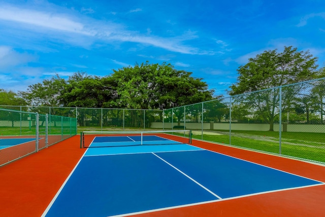 view of sport court with community basketball court and fence