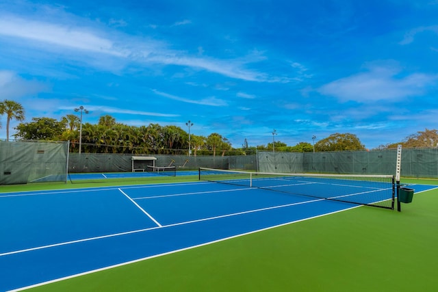 view of sport court with fence