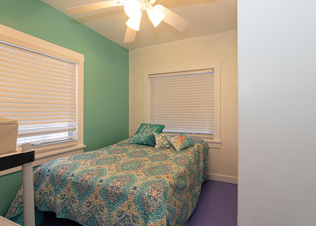 bedroom featuring baseboards and a ceiling fan