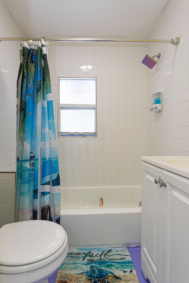 bathroom featuring shower / tub combo, tile walls, vanity, and toilet