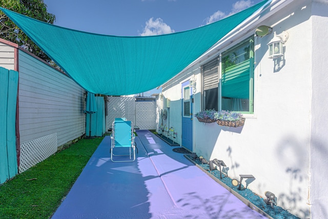 view of patio / terrace featuring fence