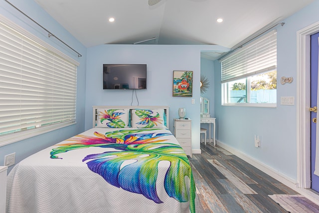 bedroom with dark wood-style floors, lofted ceiling, baseboards, and recessed lighting