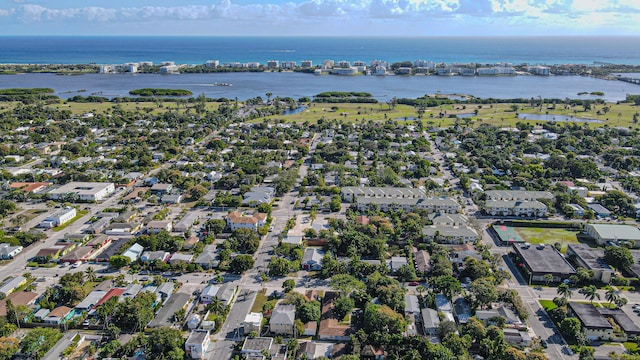 bird's eye view featuring a water view and a residential view