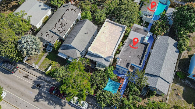 birds eye view of property with a residential view