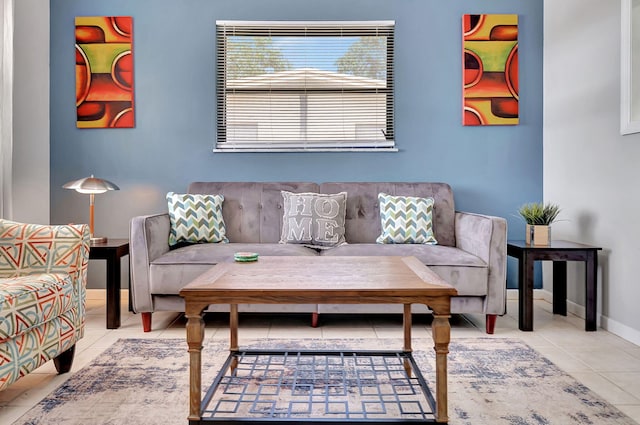 living area with baseboards and tile patterned flooring